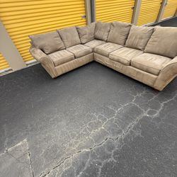 Tan 2pc sectional set W/ Coffee And 2 End Tables. $500. Will deliver for a fee.