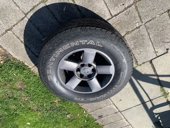 Used Tire And Nissan Rim 275/70r18 Continental 70 Percent Treading