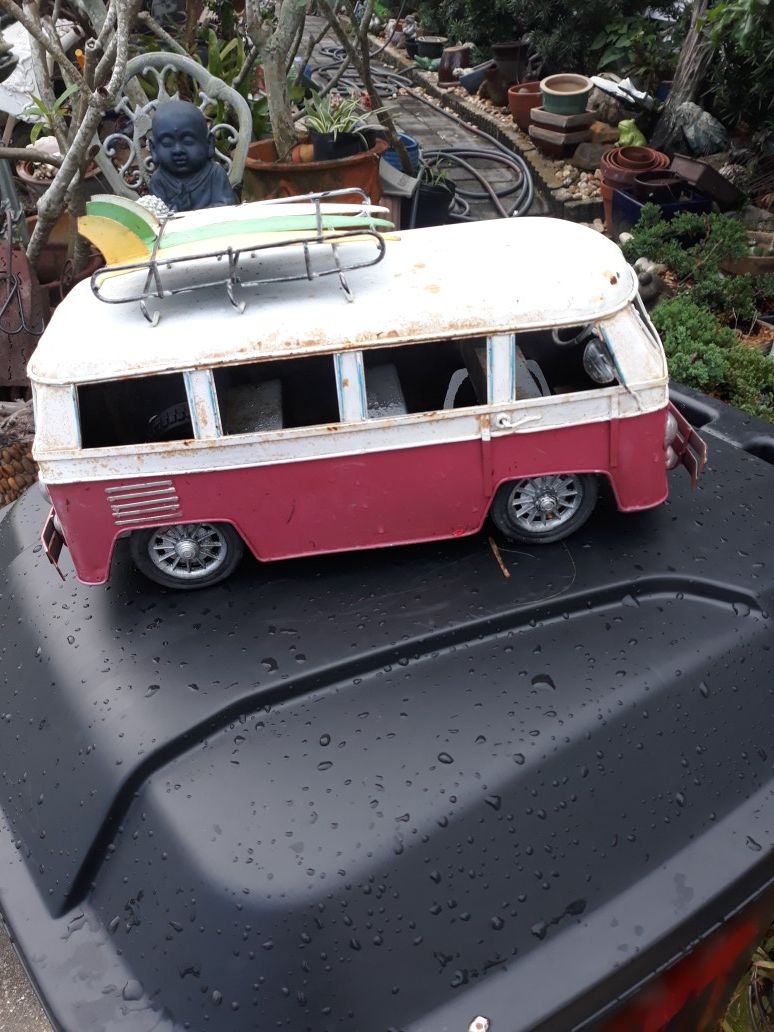 Cool metal tabletop VW bus with surfboards on top