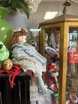 Vintage-style rag doll features curly auburn hair