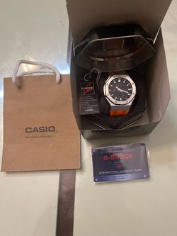 Black and orange g shock watch
