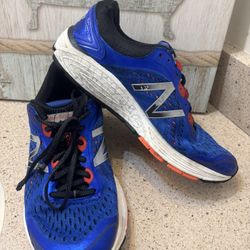 New Balance 1260v7 running shoes in a blue, black, and orange.  US Women’s size 10 or a US Men’s size 9 Need shoe strings.