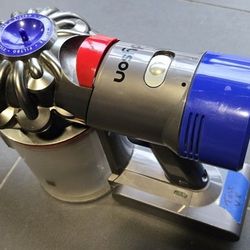 DYSON CORDLESS VACUUM V8 plus attachments & cord, battery needed.