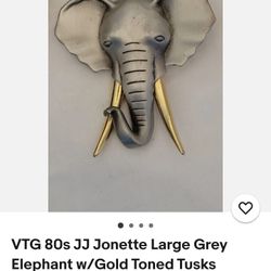 It's 80 Grey Elephant W/ Gold Tone Tusks 