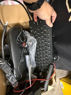 Lot of electronics, Christmas lights, and vacuum