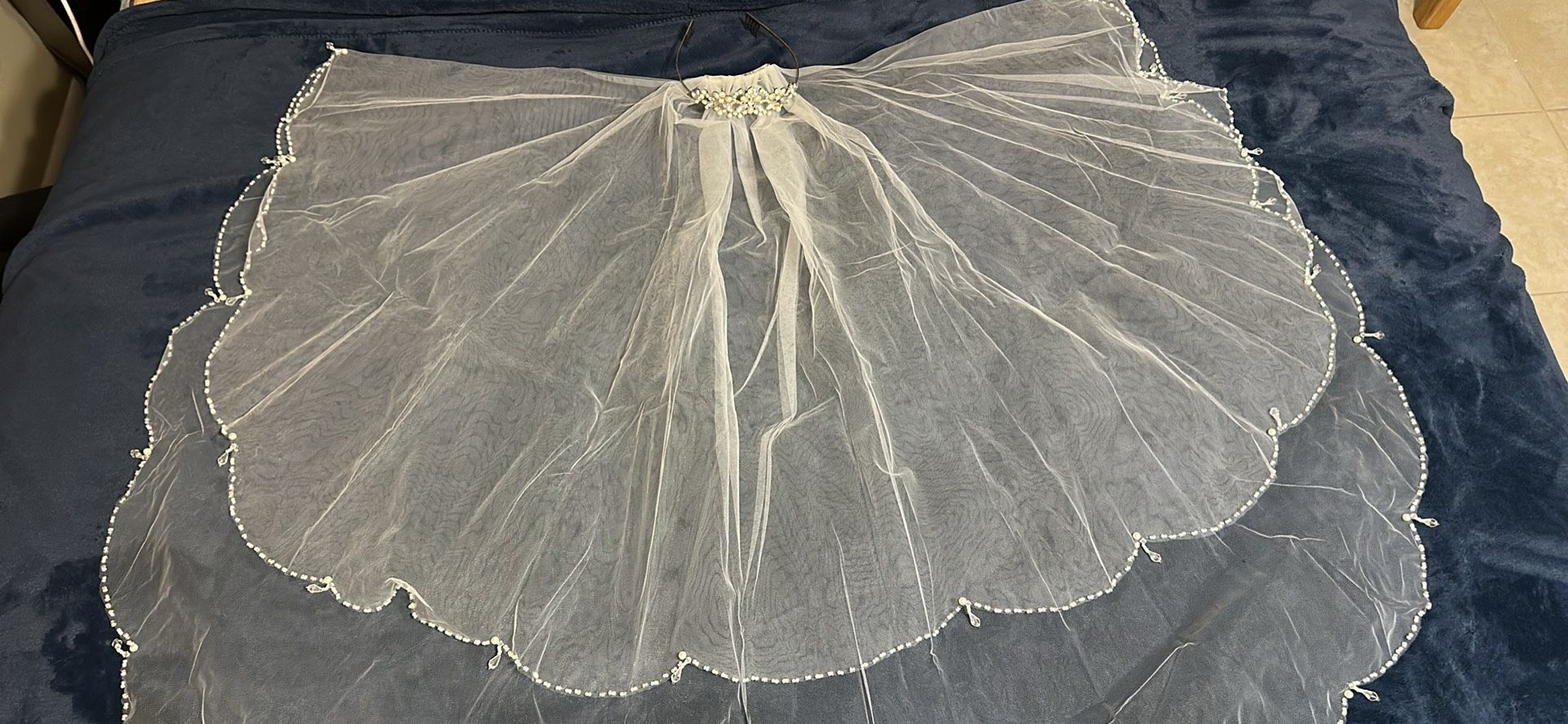 Bridal Veil and Tiara with Crystals and Pearls from David Bridal . Vail is 32” long