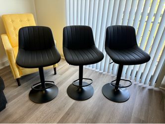 3 black swivel faux leather barstools