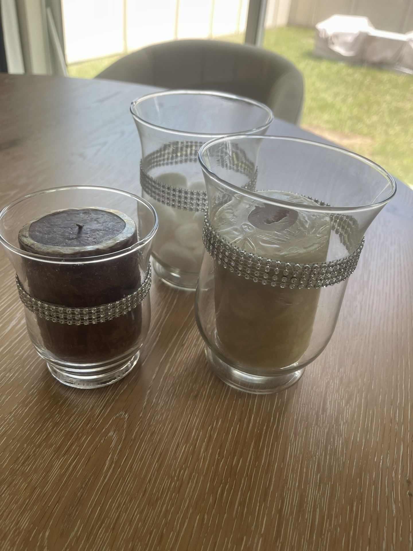 3 Candles and Candle Holders.