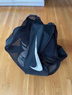 Soccer balls and Nike bag