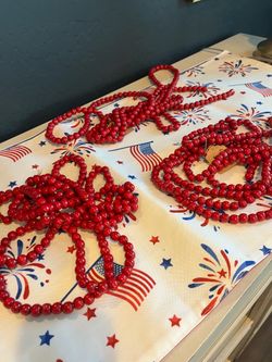 9’ of red wooden garland - 3 available, price for each $4