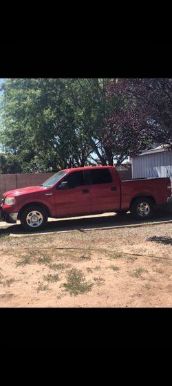 Ford F-150 Crew Cab Pickup Truck Red