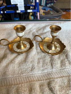 Two brass and mother of pearl candlestick holder