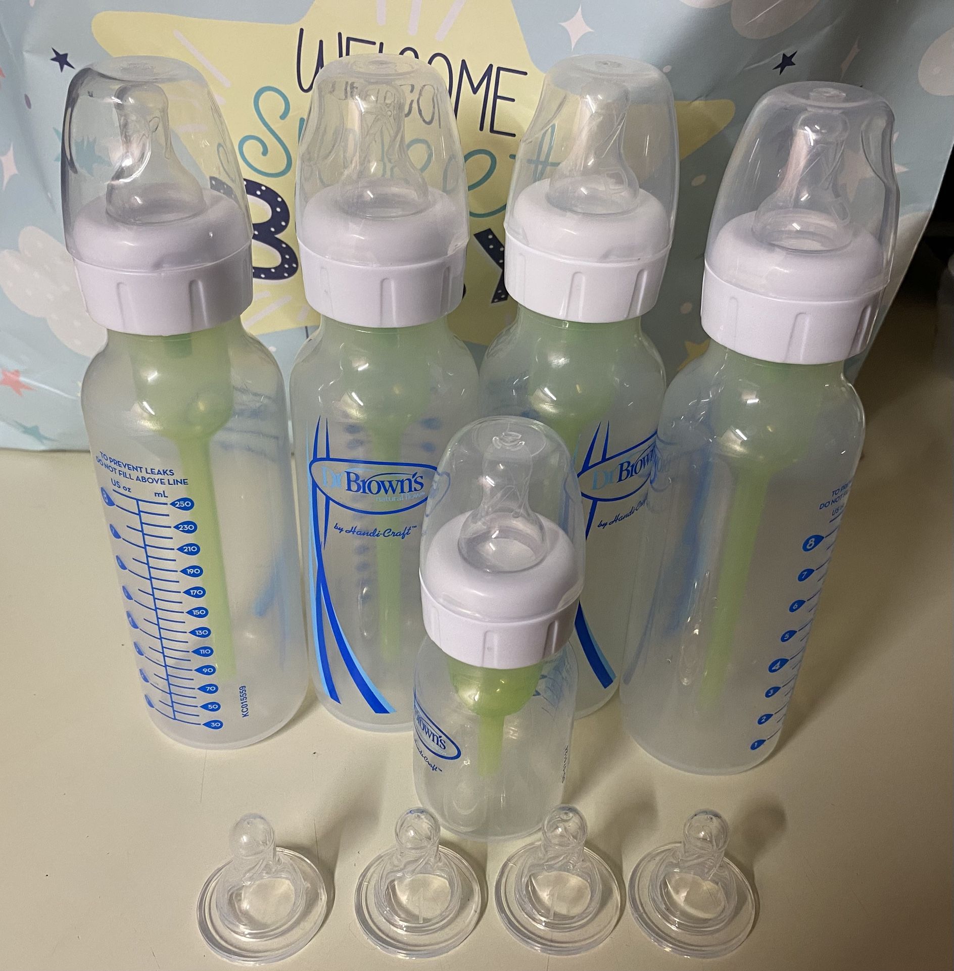 Different Brands of Bottles and Hand Pump