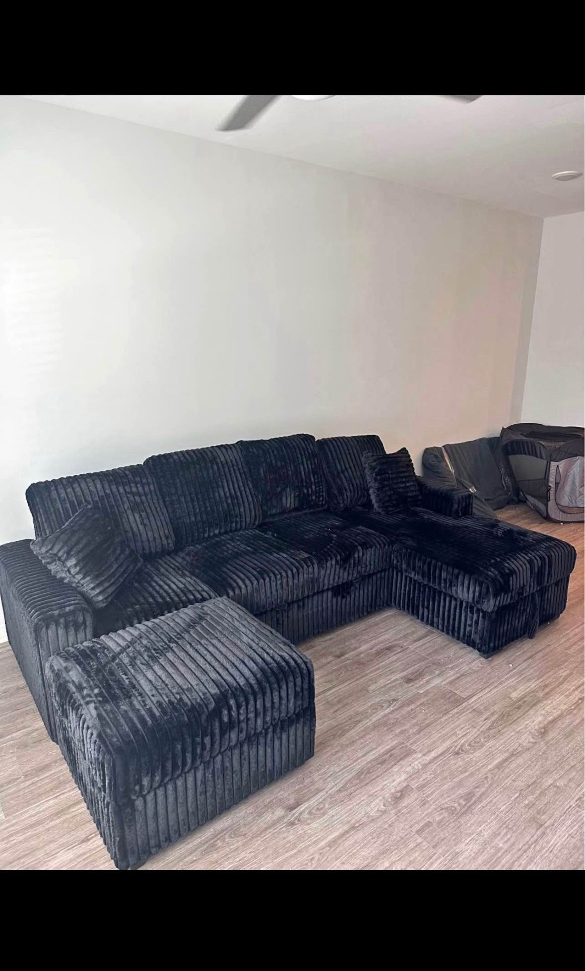 NEW BLACK RIBBED SECTIONAL W/ PULLOUT BED & DROP-DOWN TABLE – $1100