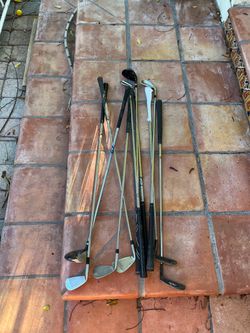 Bunch of golf clubs, putters, wedges, irons, hybrids