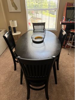 Black table with four chairs