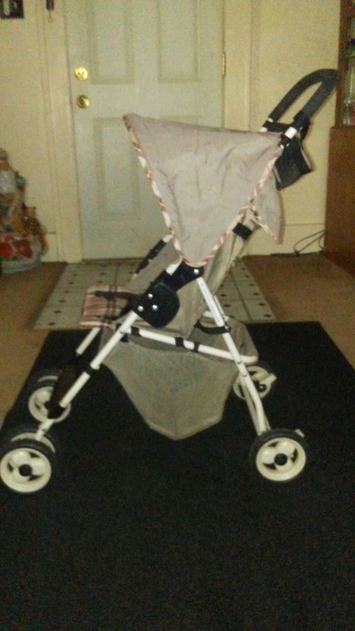 COSCO STROLLER (WITH CANOPY)FOLD'S QUICKLY FOR EASY STORAGE. $25.00 OBO.