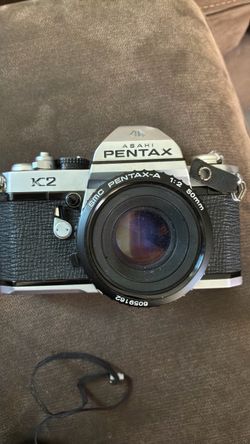 Lens and camera