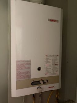 Bosch Aquastar 125B tankless water heater propane gas solid copper water tank