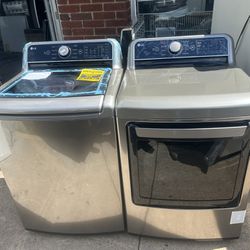 BRAND NEW NEVER USED LG GREY WASHER DRYER SET.$1000 delivered installed.$950 picked up.1year warranty 