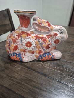 Charming handcrafted antique Japanese Imari porcelain rabbit candlestick sculpture, signed by the artist, 19th century