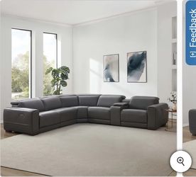 Karson Leather Power Reclining Sectional with Power Headrests
Nice leather Costco power Recliner 
New condition 
Retail price $3300 +Tax