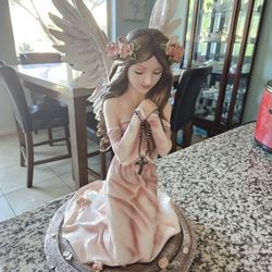 decorative kneeling angel figurine