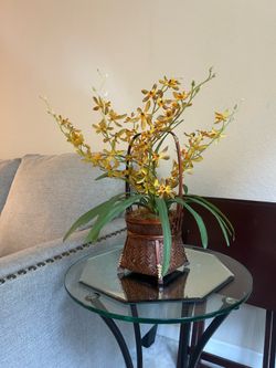 Unique Asian mod wicker basket with faux orchid arrangement