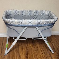 Practically New Portable Folding Rocking Bassinet ( Used Once). Price Firm!!
