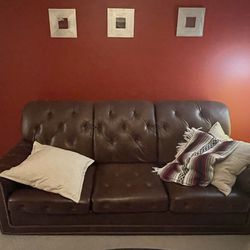 Brown three seat leather couch
