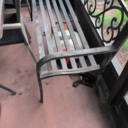 metal outdoor garden bench, specifically a 50-inch model with a distinctive floral or "lucky clover" pattern backrest
