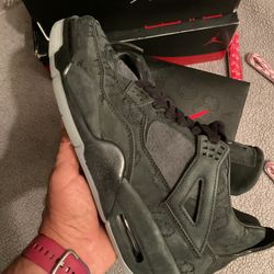 Jordan 4s  “KAWS  Black “
