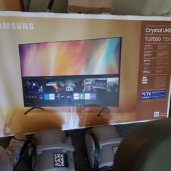 Brand new  55' Smart Samsung T.V with a brand new entertainment center  