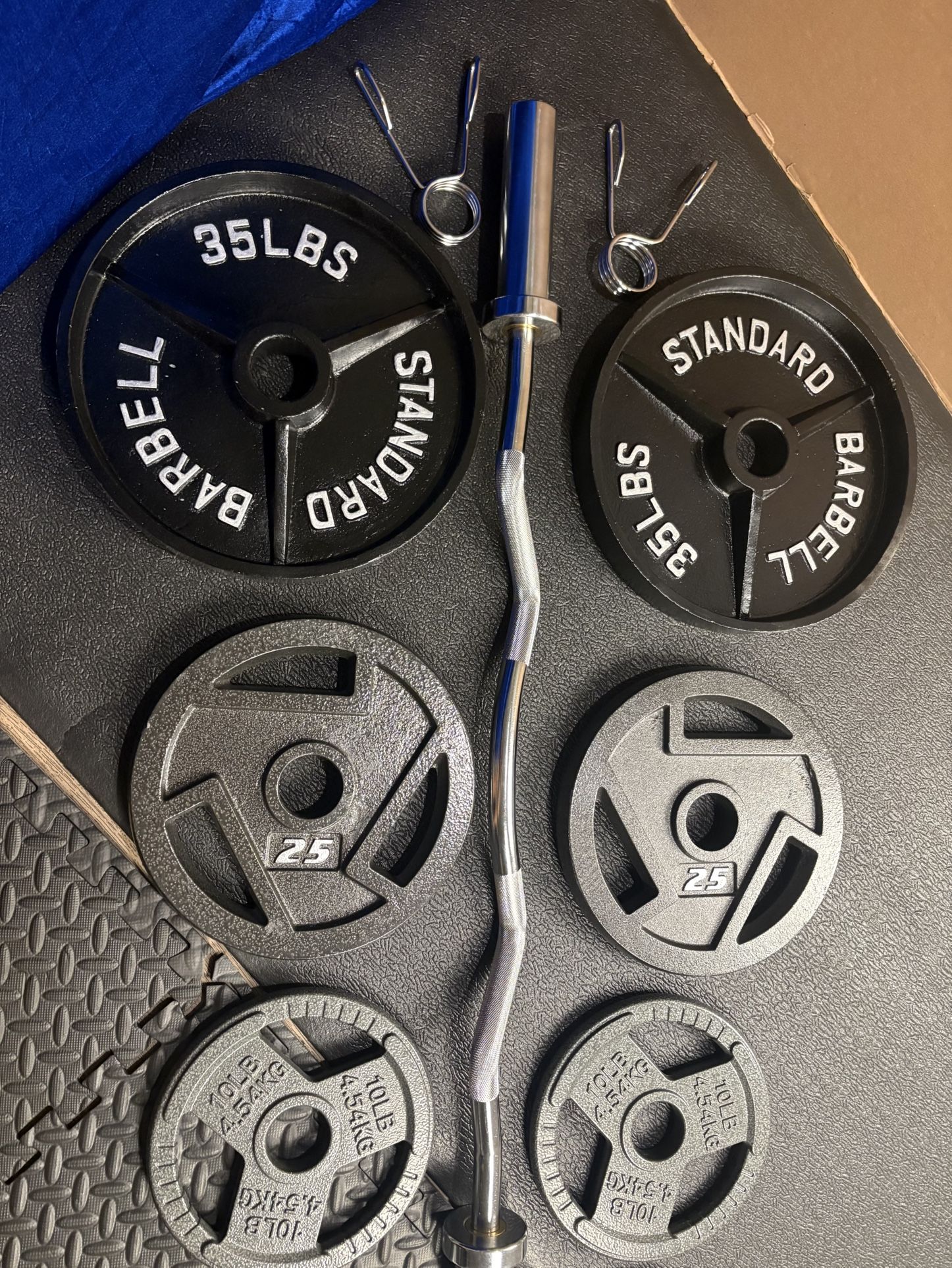 NEW Olympic Equipment Curl Bar of 20# with Cooper Bearings and Plates 2X35s, 2X25s, 2X10s and 2X5s pounds. Brute 170#