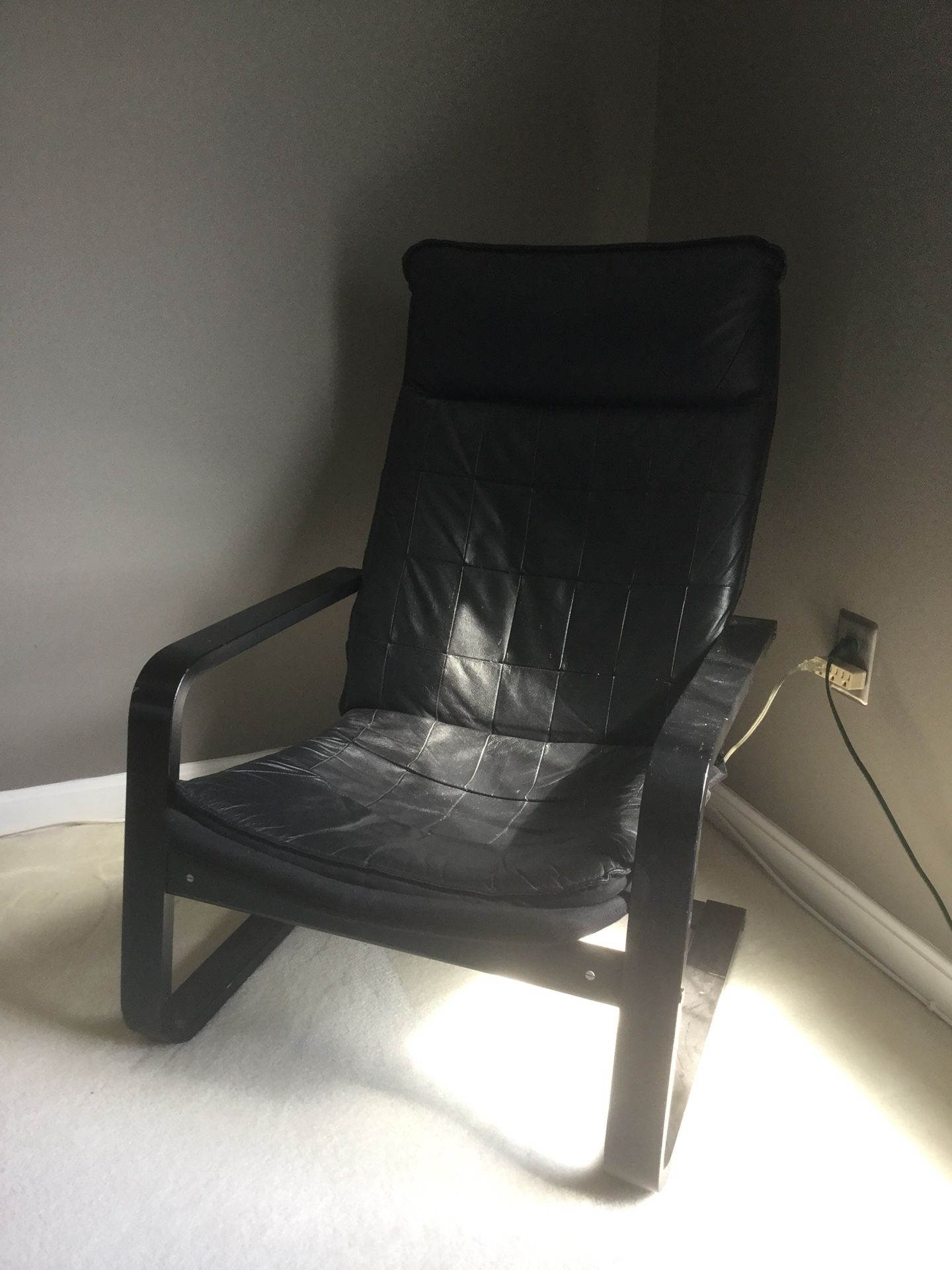 Black lounge chair. IKEA.