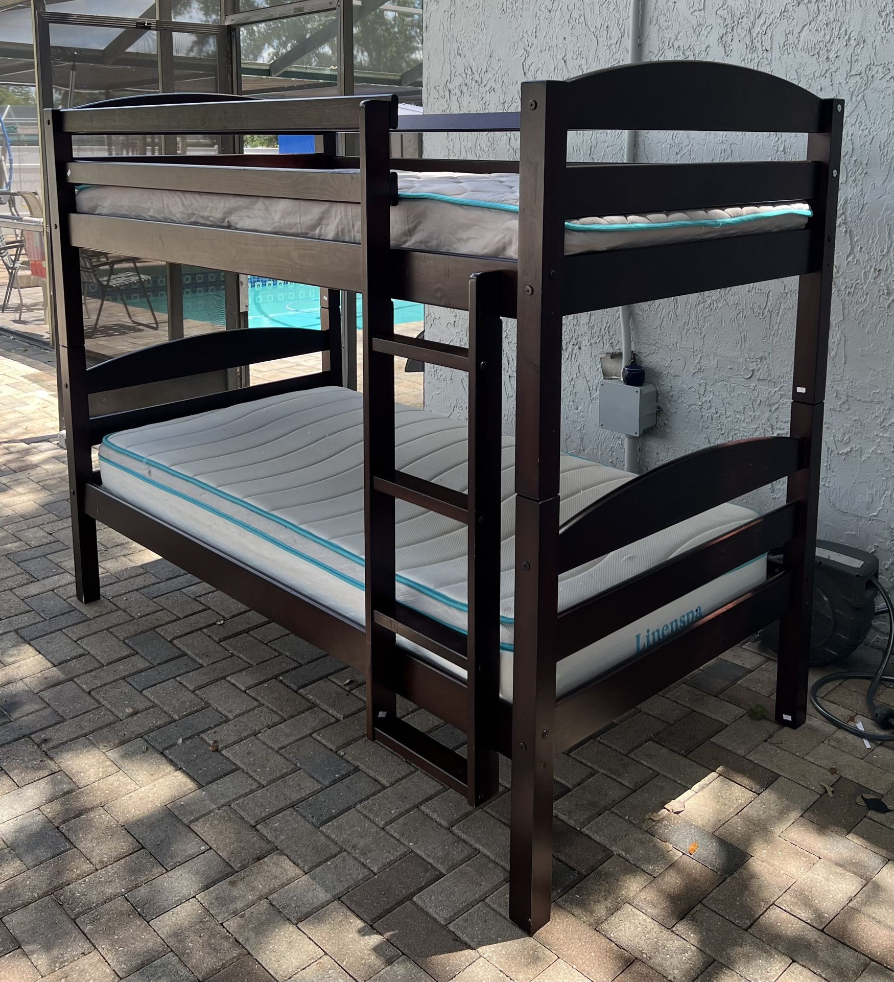 Solid wood bunk bed, double on double, 2 mattresses included. I can deliver for an additional cost. Convertible into 2 twin beds if you don’t want it