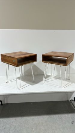 pair of wood side tables with white wire legs