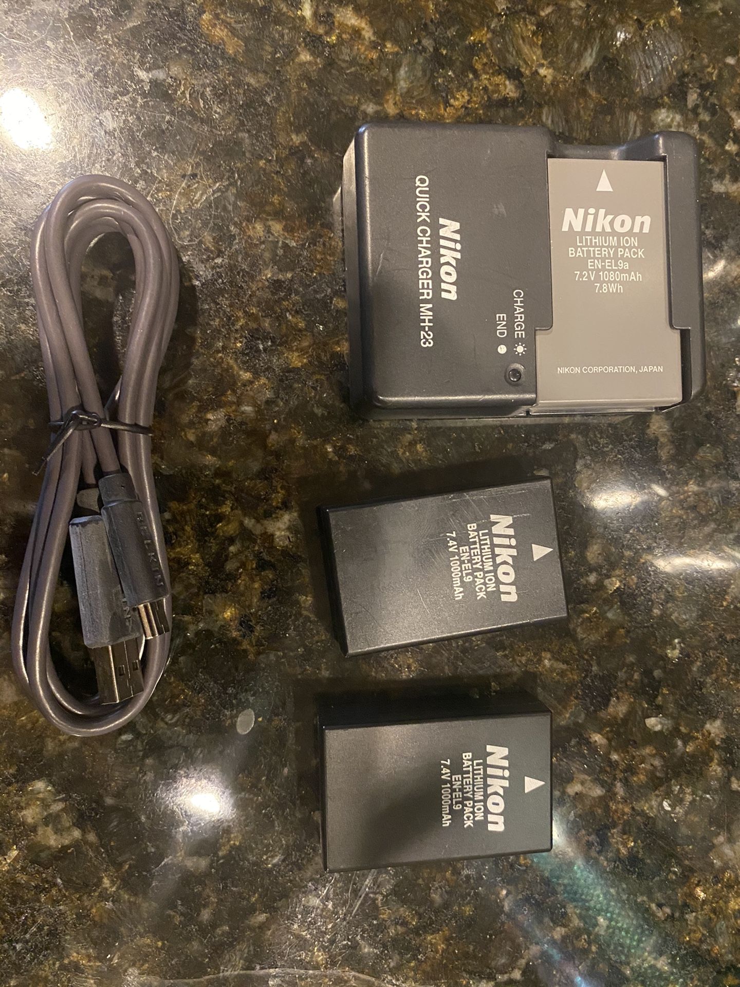 Nikon batteries and charger. $90.00 for all.