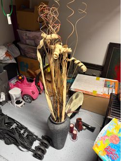 Vase with fake plants inside