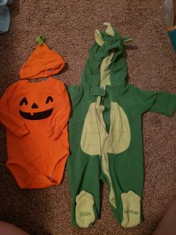 Baby dragon costume and pumpkin