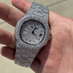 iced out bustdown watch