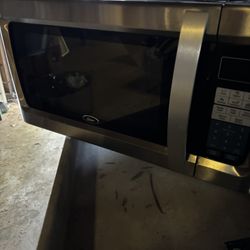 Oster Stainless Countertop Microwave Light Use 