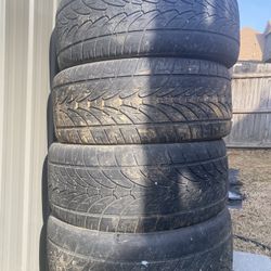 A Set Tires And Aluminum Wheels 