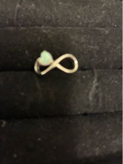 Opal infinity ring with heart shaped stone