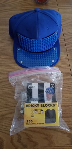 Elope bricky blocks hat and 230 blocks. Opened But New.