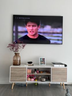 Cream and white tv stand for tvs up to 60”