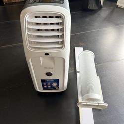 Air conditioner with vent and window attachment. 