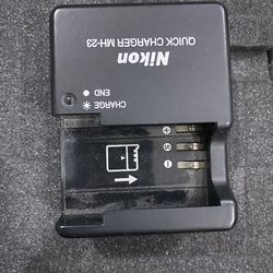 Nikon MH-23 Quick Charger designed to charge EN-EL9 and EN-EL9a rechargeable Lithium-ion batteries.