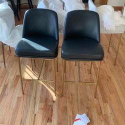 2 Black And Gold Chairs 