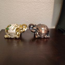 Decorative metal ashtray shaped like an elephant, often described as vintage or retro in style. 